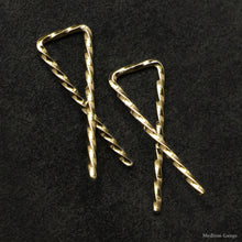 Load image into Gallery viewer, Detail view of 18K Yellow Gold Sibling Ribbons Twisted Earrings representing we are all brothers and sisters by Caps Brothers