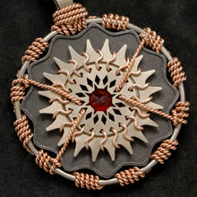 Load image into Gallery viewer, Detail view of 18K Rose Gold and 18K Palladium White Gold and Sterling Silver and Ruby Sewn Gold Metal Majesty pendant featuring 20 pointed gear by Caps Brothers