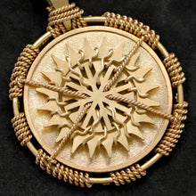 Load image into Gallery viewer, Detail view of 18K Yellow Gold Sewn Gold Metal Sun pendant featuring 20 pointed gear by Caps Brothers