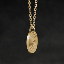Load image into Gallery viewer, Side view of 18K Yellow Gold Journey pendant and chain with endless loop necklace featuring labyrinth as inward journey by Caps Brothers