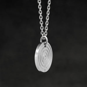 Side view of Platinum 950 Journey pendant featuring labyrinth as inward journey by Caps Brothers