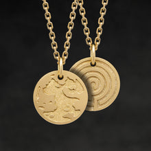 Load image into Gallery viewer, Hanging view of 18K Yellow Gold Journey pendant and chain with endless loop necklace featuring the Map of Humanity as outward journey and labyrinth as inward journey by Caps Brothers