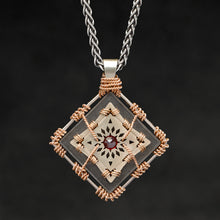 Load image into Gallery viewer, Hanging front view of 18K Rose Gold and 18K Palladium White Gold and Sterling Silver and Ruby Sewn Gold Metal Confidence pendant and chain with endless loop necklace featuring 4 pointed gear by Caps Brothers