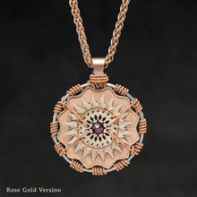 Load image into Gallery viewer, Hanging front view of 18K Rose Gold and 18K Palladium White Gold and Sapphire Sewn Gold Metal Majesty pendant and chain with endless loop necklace featuring 20 pointed gear by Caps Brothers