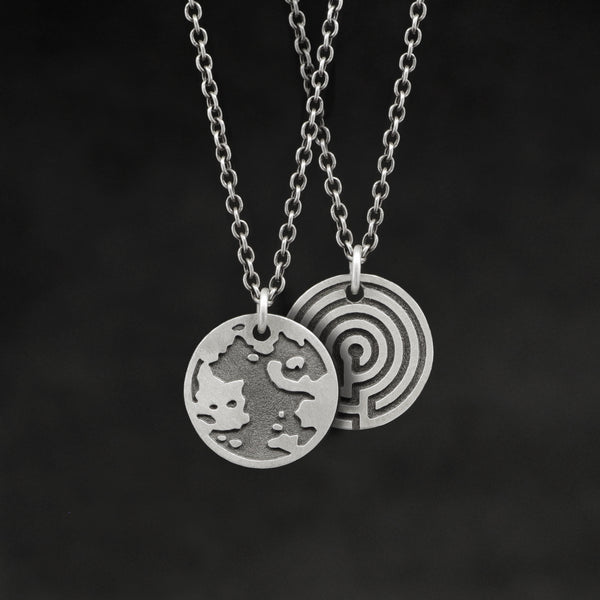 Hanging view of Sterling Silver Journey pendant and chain necklace featuring the Map of Humanity as outward journey and labyrinth as inward journey by Caps Brothers
