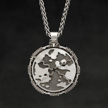 Load image into Gallery viewer, Hanging reverse view of Sterling Silver and 18K Yellow Gold Accents Sewn Silver Metal Sun pendant and chain with endless loop necklace featuring Map of Humanity by Caps Brothers