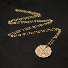 Load image into Gallery viewer, Laying down 18K Yellow Gold Journey pendant and chain with endless loop necklace featuring labyrinth as inward journey by Caps Brothers