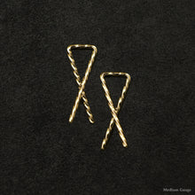 Load image into Gallery viewer, Laying down pair of 18K Yellow Gold Sibling Ribbons Twisted Earrings representing we are all brothers and sisters by Caps Brothers