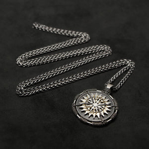 Laying down view of Sterling Silver and 18K Yellow Gold Accents Sewn Silver Metal Sun pendant and chain with endless loop necklace featuring 20 pointed gear by Caps Brothers