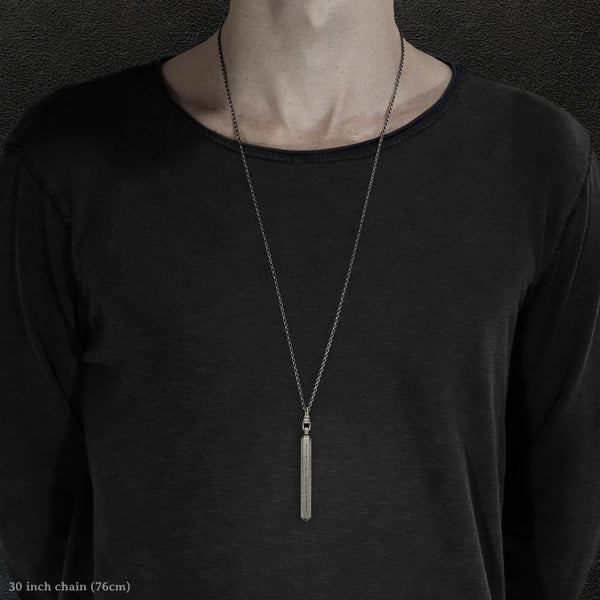 Model wearing Code of Consciousness hexagonal sterling silver pendant and chain with endless loop necklace featuring Dashless Morse Code by Caps Brothers