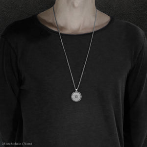 Model wearing Platinum 950 Sewn Platinum Metal Compass pendant and chain with endless loop necklace featuring 20 pointed gear by Caps Brothers