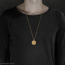 Load image into Gallery viewer, Model wearing 18K Yellow Gold Sewn Gold Metal Sun pendant and chain with endless loop necklace featuring 20 pointed gear by Caps Brothers