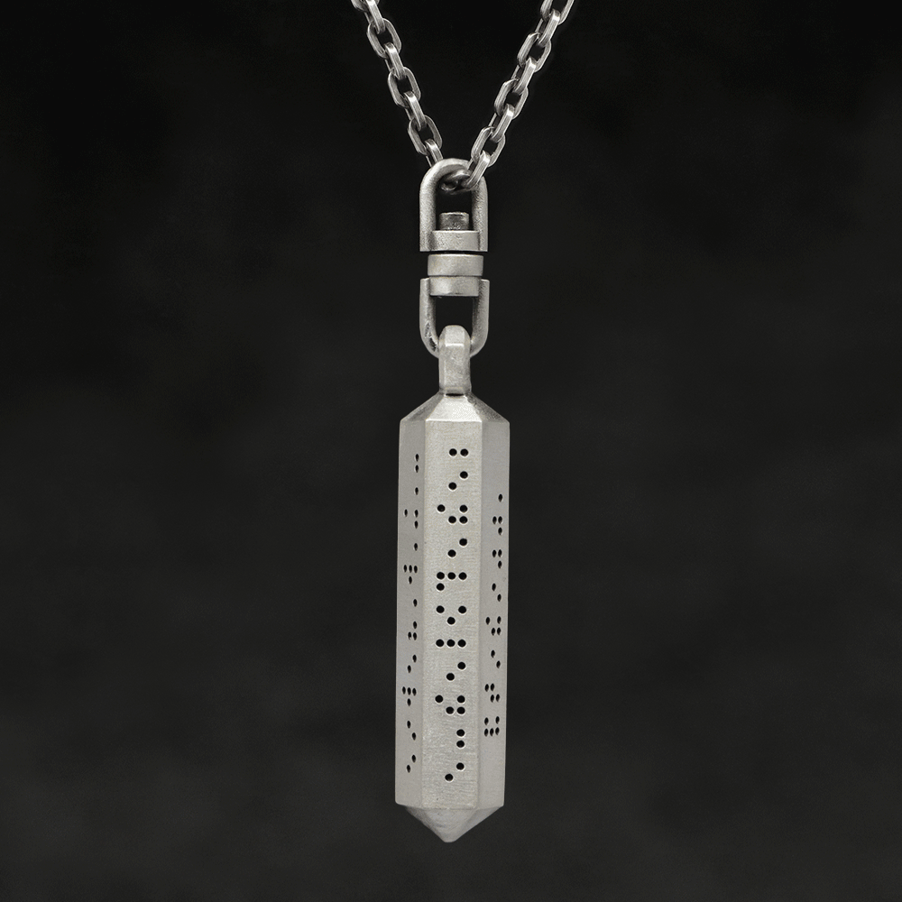 Rotating view of Code of Friendship hexagonal sterling silver pendant and chain with endless loop necklace featuring Inverted Braille by Caps Brothers