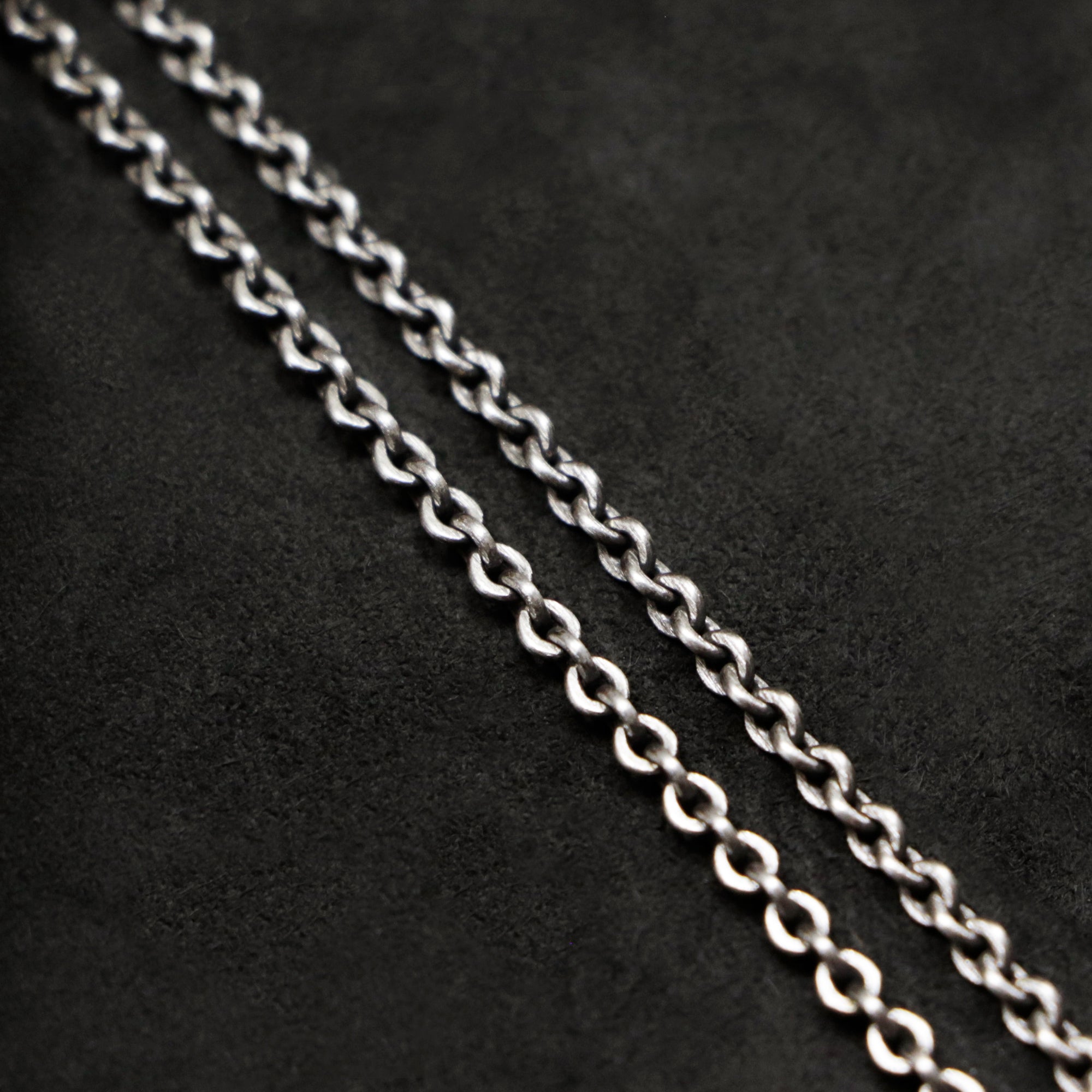 Chain closeup of Code of Wisdom sterling silver chain with endless loop necklace by Caps Brothers
