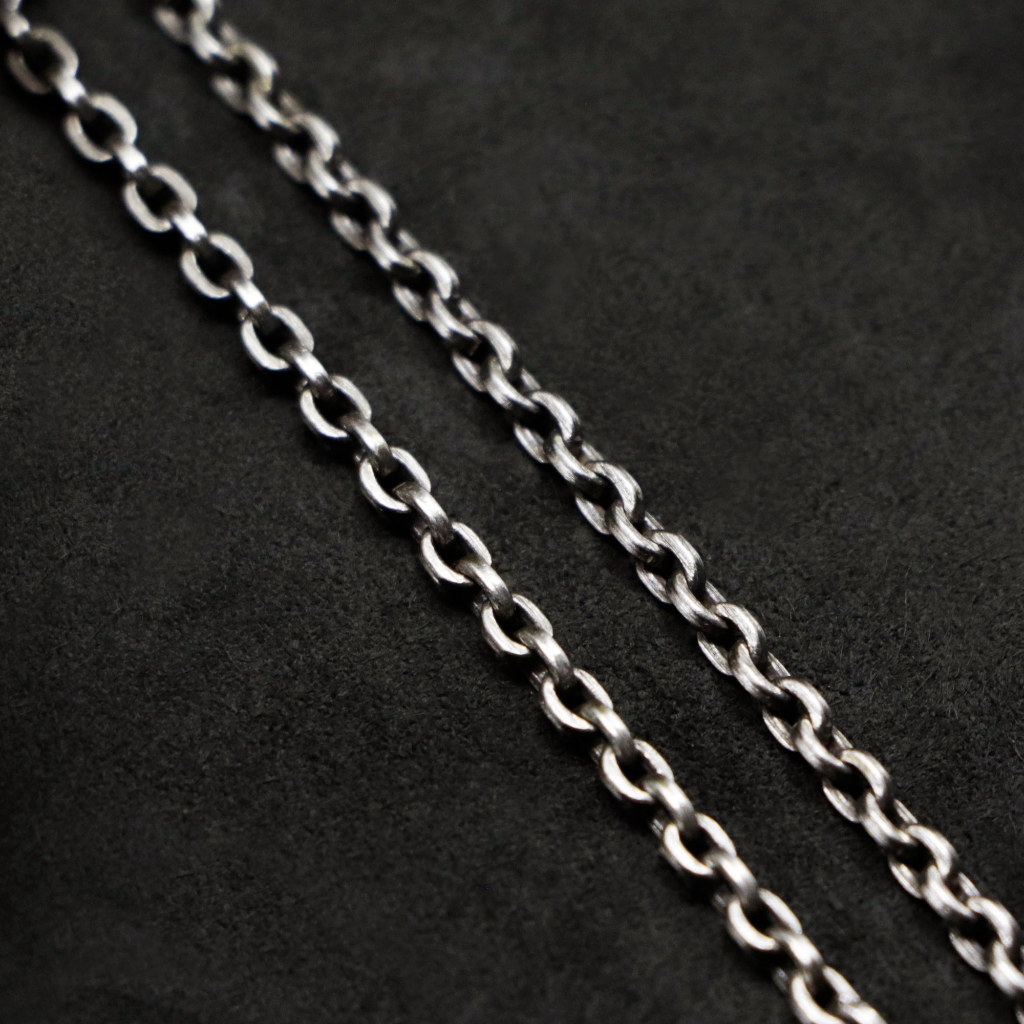 Chain closeup of Code of Consciousness sterling silver chain with endless loop necklace by Caps Brothers