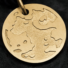 Load image into Gallery viewer, Detail view of 18K Yellow Gold Journey pendant featuring the Map of Humanity as outward journey by Caps Brothers