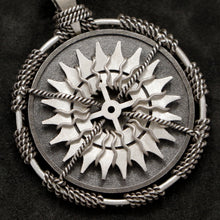 Load image into Gallery viewer, Detail view of Sterling Silver and 18K Palladium White Gold Accents Sewn Silver Metal Compass pendant featuring 20 pointed gear by Caps Brothers