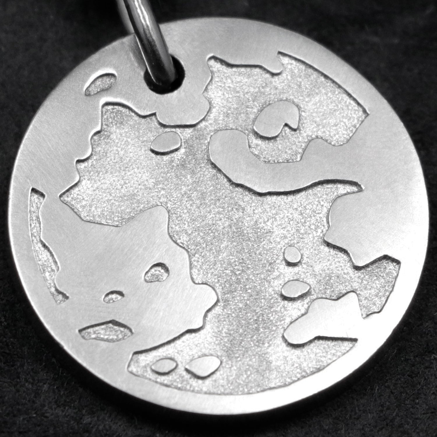 Detail view of Platinum 950 Journey pendant featuring the Map of Humanity as outward journey by Caps Brothers