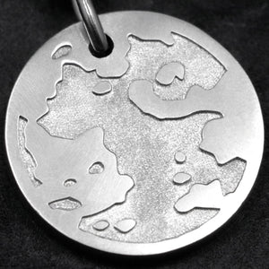 Detail view of Platinum 950 Journey pendant featuring the Map of Humanity as outward journey by Caps Brothers