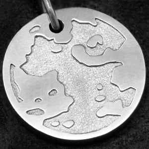 Detail view of Platinum 950 Journey pendant featuring the Map of Humanity as outward journey by Caps Brothers