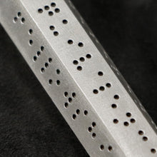 Load image into Gallery viewer, Detail view of Code of Code of Friendship hexagonal sterling silver pendant and chain with endless loop necklace featuring Inverted Braille by Caps Brothers