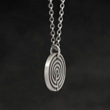 Load image into Gallery viewer, Side view of Sterling Silver Journey pendant and chain with endless loop necklace featuring labyrinth as inward journey by Caps Brothers