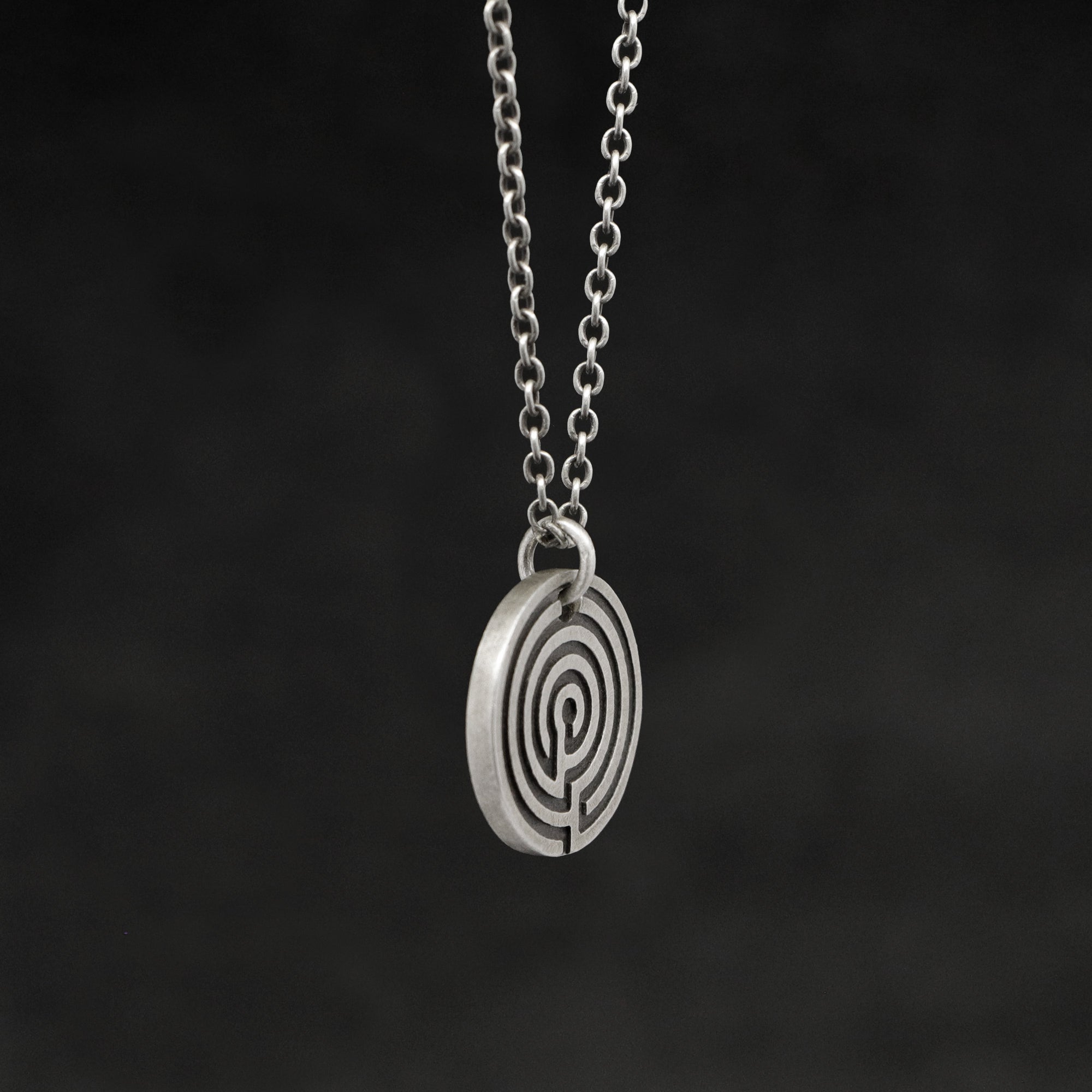 Side view of Sterling Silver Journey pendant and chain necklace featuring labyrinth as inward journey by Caps Brothers