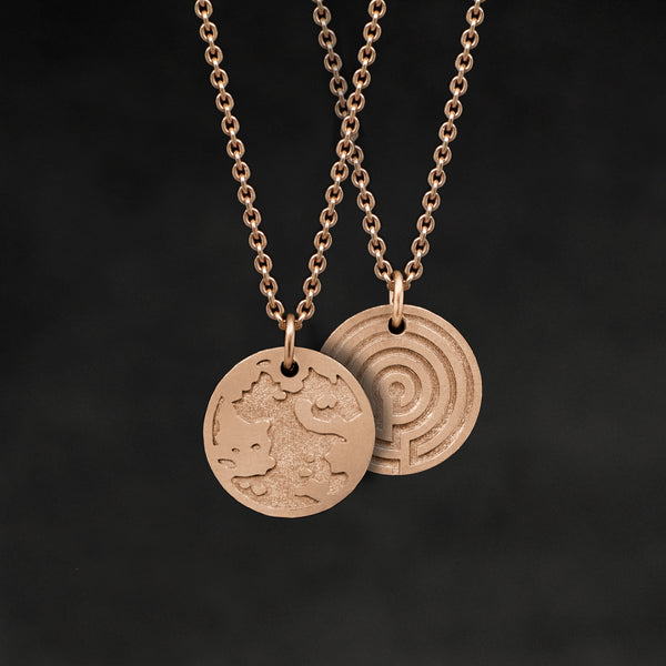 Hanging view of 18K Rose Gold Journey pendant and chain necklace featuring the Map of Humanity as outward journey and labyrinth as inward journey by Caps Brothers