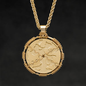 Hanging reverse view of 18K Yellow Gold Sewn Gold Metal Sun pendant and chain with endless loop necklace featuring Map of Humanity by Caps Brothers