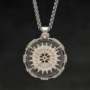 Hanging front view of 18K Palladium White Gold and Sterling Silver Sewn Gold Metal Compass pendant and chain with endless loop necklace featuring 20 pointed gear by Caps Brothers