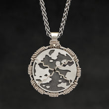 Load image into Gallery viewer, Hanging reverse view of 18K Palladium White Gold and Sterling Silver Sewn Gold Metal Compass pendant and chain with endless loop necklace featuring Map of Humanity by Caps Brothers
