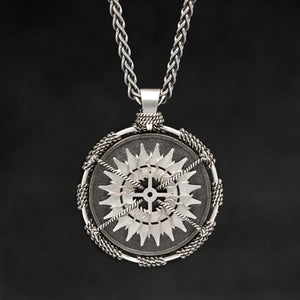 Hanging front view of Sterling Silver and 18K Palladium White Gold Accents Sewn Silver Metal Compass pendant and chain with endless loop necklace featuring 20 pointed gear by Caps Brothers