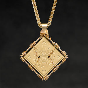Hanging reverse view of 18K Yellow Gold and 18K Palladium White Gold Sewn Gold Metal Confidence pendant and chain with endless loop necklace featuring Electromagnetic Field and Cardinal Directions by Caps Brothers