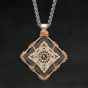Hanging front view of 18K Rose Gold and 18K Palladium White Gold and Sterling Silver and Ruby Sewn Gold Metal Confidence pendant and chain with endless loop necklace featuring 4 pointed gear by Caps Brothers