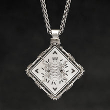 Load image into Gallery viewer, Hanging reverse view of Sterling Silver and 18K Palladium White Gold Accents Sewn Silver Metal Confidence pendant and chain with endless loop necklace featuring Electromagnetic Field and Cardinal Directions by Caps Brothers
