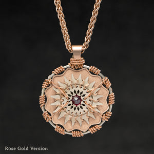 Hanging front view of 18K Rose Gold and 18K Palladium White Gold and Sapphire Sewn Gold Metal Majesty pendant and chain with endless loop necklace featuring 20 pointed gear by Caps Brothers