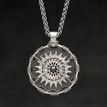 Load image into Gallery viewer, Hanging front view of Sterling Silver and 18K Palladium White Gold Accents and Black Sapphire Sewn Silver Metal Majesty pendant and chain with endless loop necklace featuring 20 pointed gear by Caps Brothers
