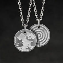 Load image into Gallery viewer, Hanging view of Platinum 950 Journey pendant and chain with endless loop necklace featuring the Map of Humanity as outward journey and labyrinth as inward journey by Caps Brothers