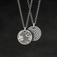 Load image into Gallery viewer, Hanging view of Sterling Silver Journey pendant and chain necklace featuring the Map of Humanity as outward journey and labyrinth as inward journey by Caps Brothers