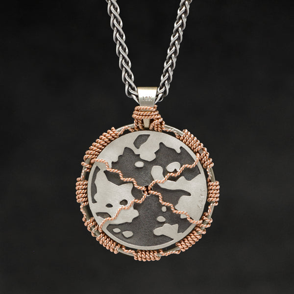 Hanging reverse view of 18K Rose Gold and 18K Palladium White Gold and Sterling Silver Sewn Silver Metal Sun pendant and chain with endless loop necklace featuring Map of Humanity by Caps Brothers
