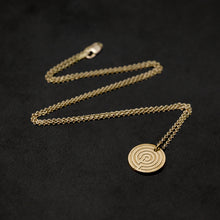 Load image into Gallery viewer, Laying down 18K Yellow Gold Journey pendant and chain necklace with clasp featuring labyrinth as inward journey by Caps Brothers