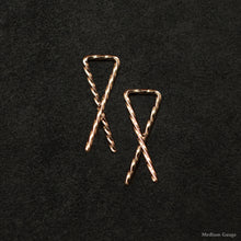 Load image into Gallery viewer, Laying down pair of 18K Rose Gold Sibling Ribbons Twisted Earrings representing we are all brothers and sisters by Caps Brothers
