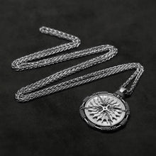 Load image into Gallery viewer, Laying down view of Platinum 950 Sewn Platinum Metal Compass pendant and chain with endless loop necklace featuring 20 pointed gear by Caps Brothers