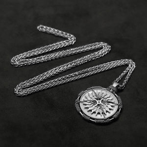 Laying down view of Platinum 950 Sewn Platinum Metal Compass pendant and chain with endless loop necklace featuring 20 pointed gear by Caps Brothers