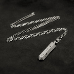 Laying down Code of Friendship hexagonal sterling silver pendant and chain with endless loop necklace featuring Inverted Braille by Caps Brothers