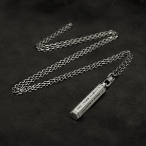 Laying down Code of Integrity hexagonal sterling silver pendant and chain with endless loop necklace featuring Truncated Barcode by Caps Brothers