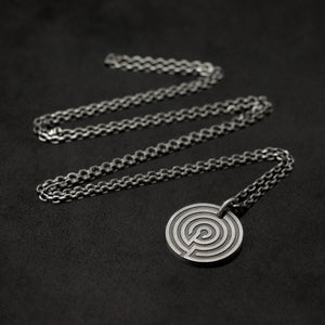 Laying down Sterling SilverJourney pendant and chain with endless loop necklace featuring labyrinth as inward journey by Caps Brothers