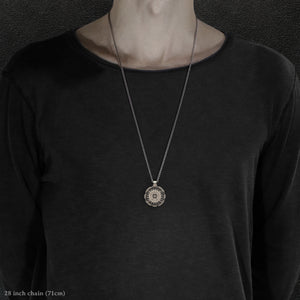 Model wearing 18K Palladium White Gold and Sterling Silver Sewn Gold Metal Compass pendant and chain with endless loop necklace featuring 20 pointed gear by Caps Brothers