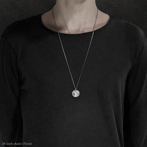 Model wearing Platinum 950 Journey pendant and chain with endless loop necklace featuring the Map of Humanity as outward journey by Caps Brothers