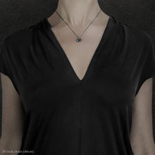 Load image into Gallery viewer, Model wearing Sterling Silver Journey pendant and chain necklace featuring the Map of Humanity as outward journey by Caps Brothers